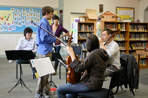 A Greenwood student works with the Parker Quartet