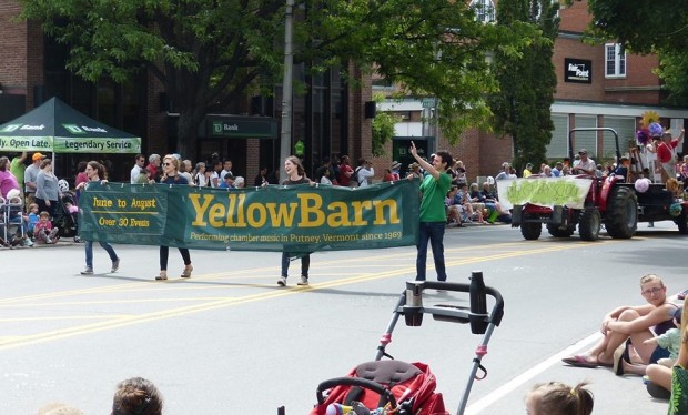 Yellow Barn marching in Brattleboro's famed "Strolling of the Heifers" parade